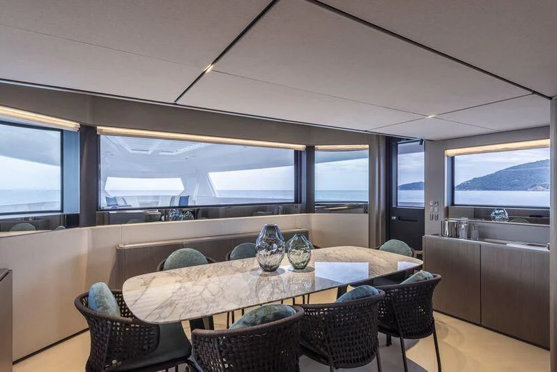a dining table in a train aboard INFYNITO 90/01 Yacht for Sale