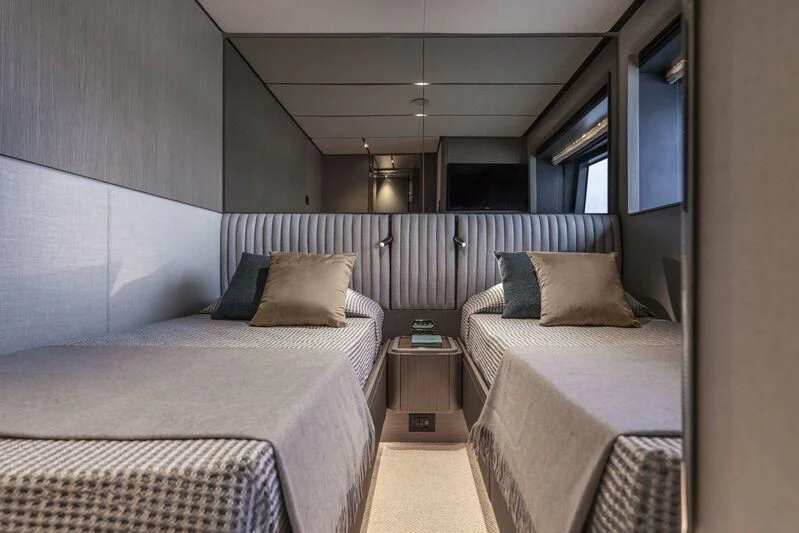 a room with two beds aboard INFYNITO 90/01 Yacht for Sale