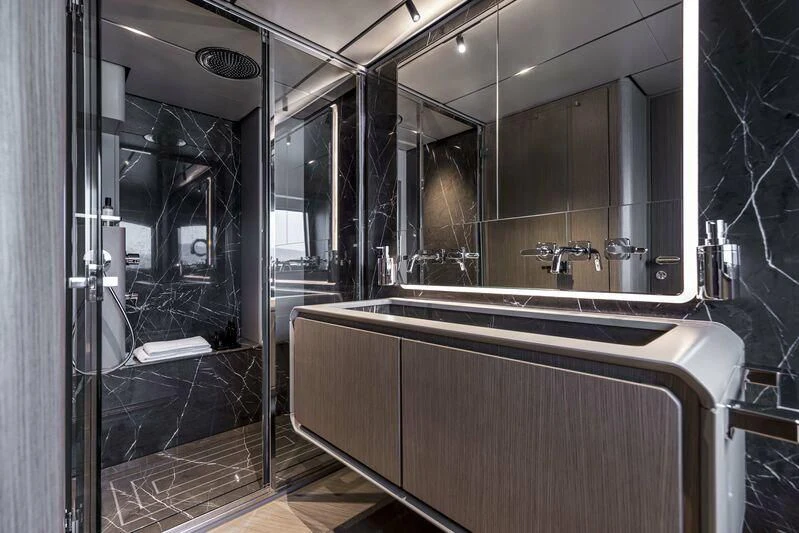 a bathroom with a large mirror aboard INFYNITO 90/01 Yacht for Sale