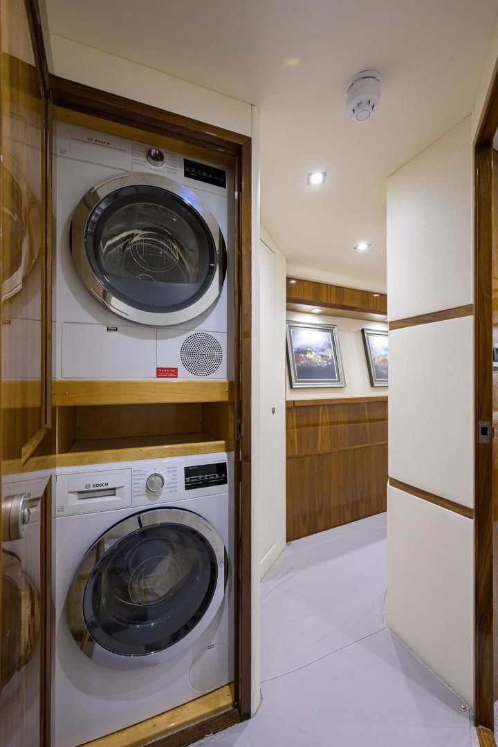 a washing machine and dryer in a room aboard QUICK RAISE Yacht for Sale