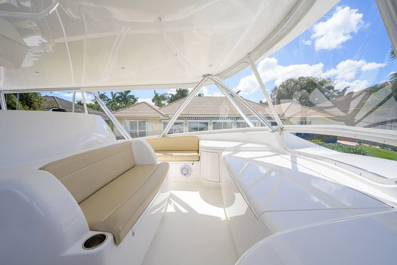 a room with a large window and a view of a house aboard QUICK RAISE Yacht for Sale