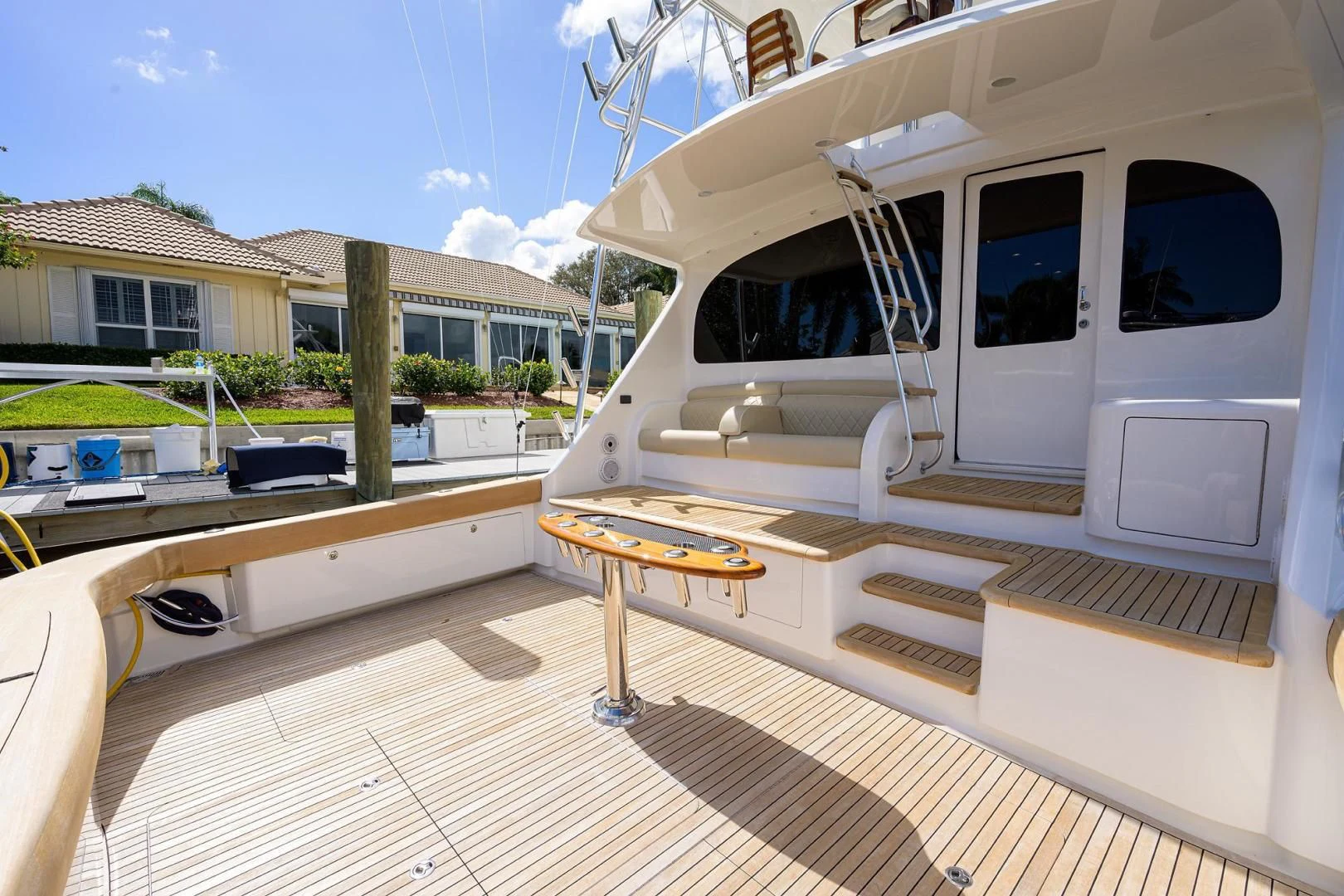 a deck with a table and chairs aboard QUICK RAISE Yacht for Sale