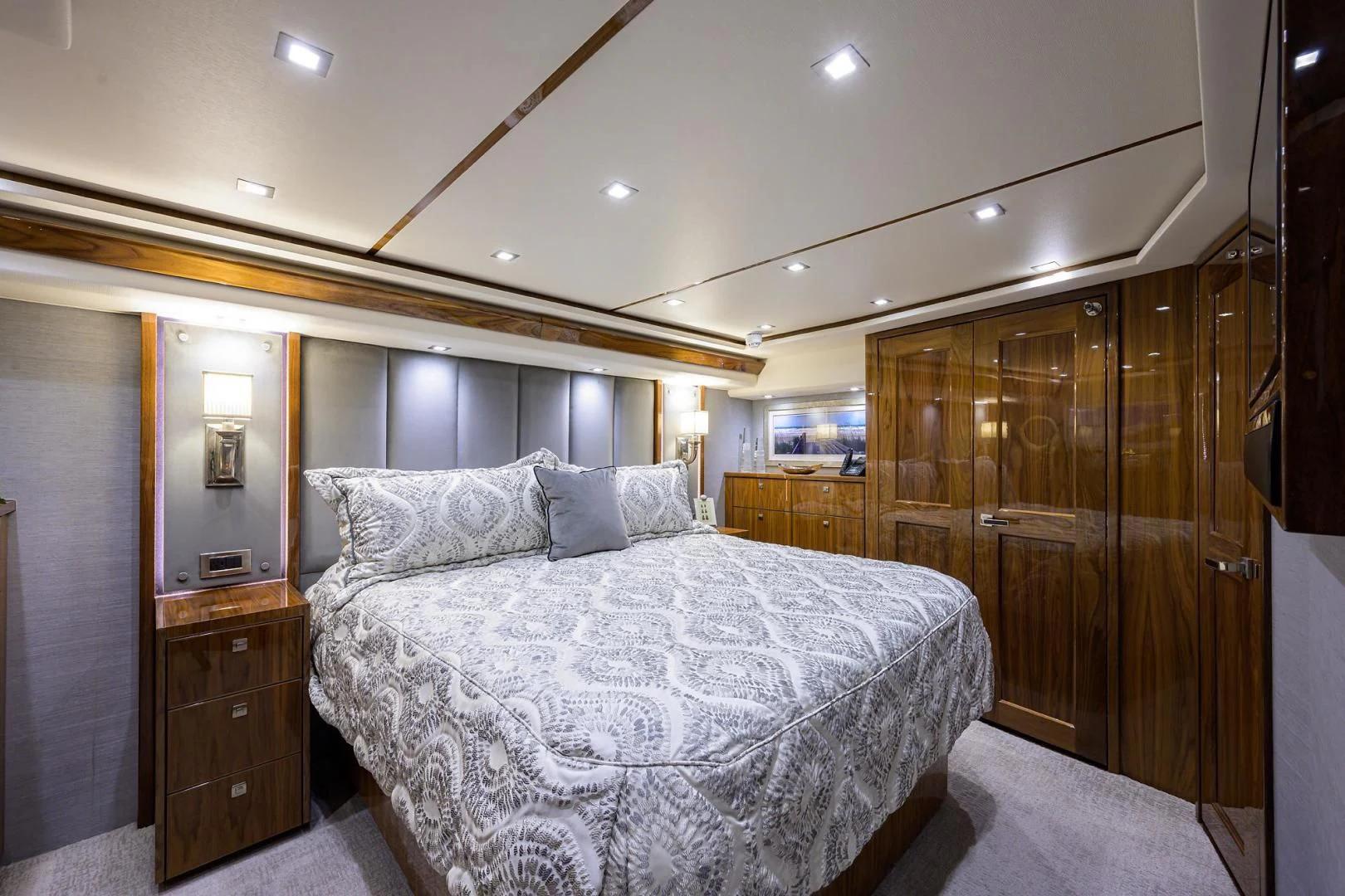 a bedroom with a bed and a closet aboard QUICK RAISE Yacht for Sale