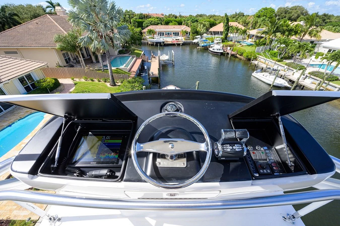a boat with a steering wheel aboard QUICK RAISE Yacht for Sale