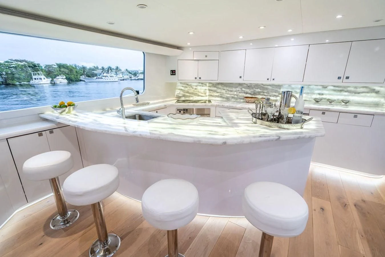 a kitchen with stools and stools aboard COURTNEY ANNE Yacht for Sale