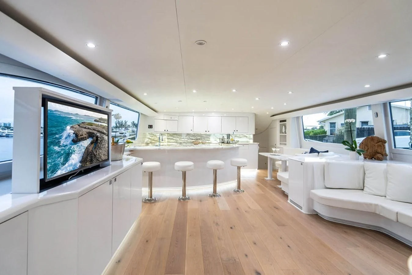 a living room with a large screen aboard COURTNEY ANNE Yacht for Sale