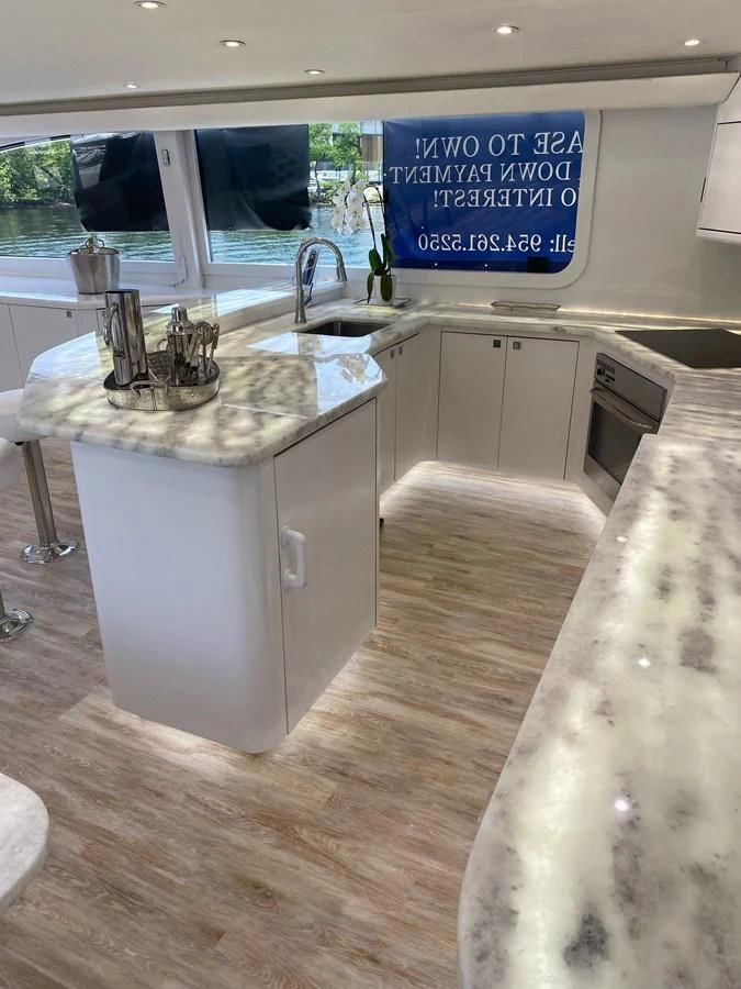 a kitchen with a sign on the wall aboard COURTNEY ANNE Yacht for Sale