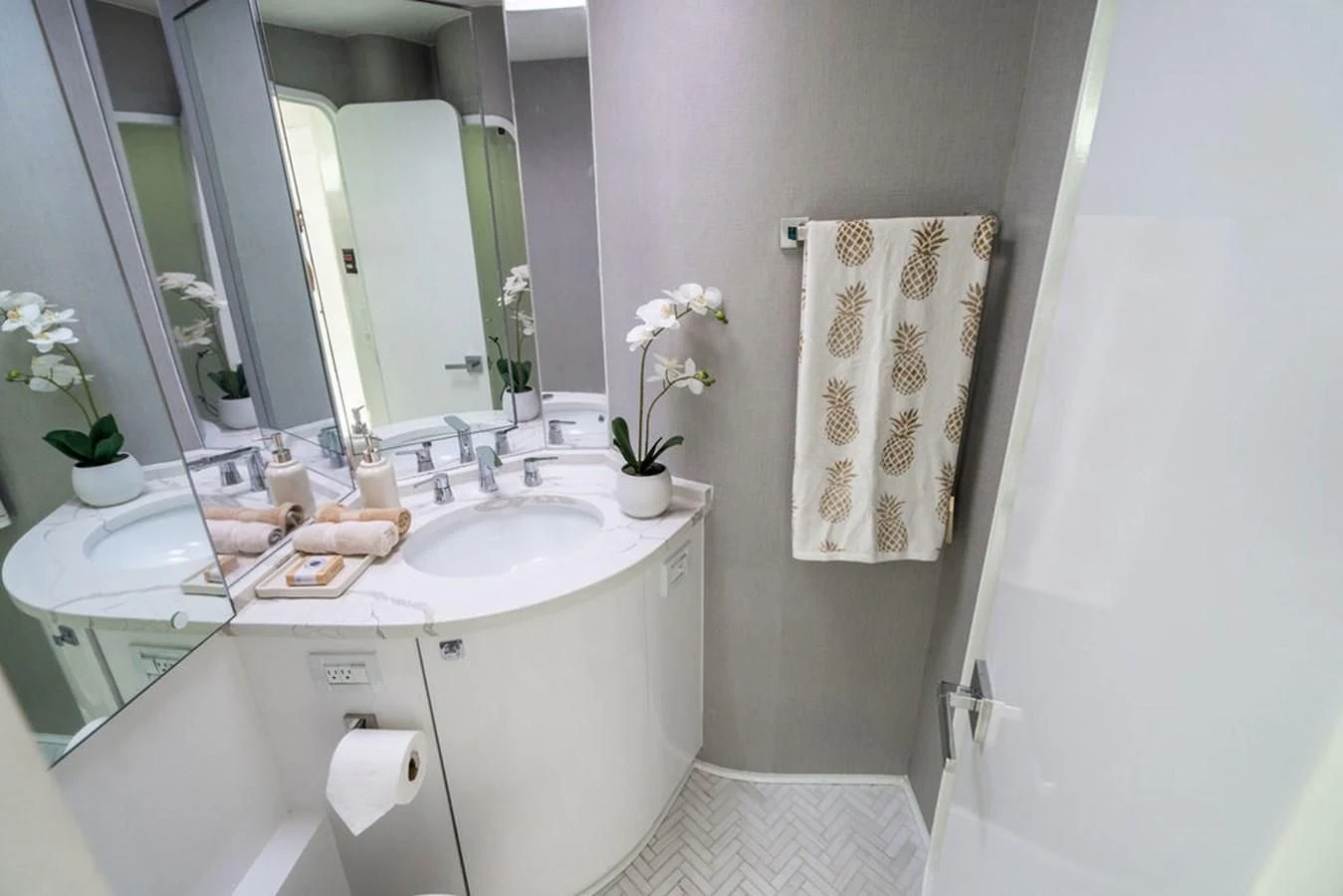 a bathroom with a sink and towels aboard COURTNEY ANNE Yacht for Sale
