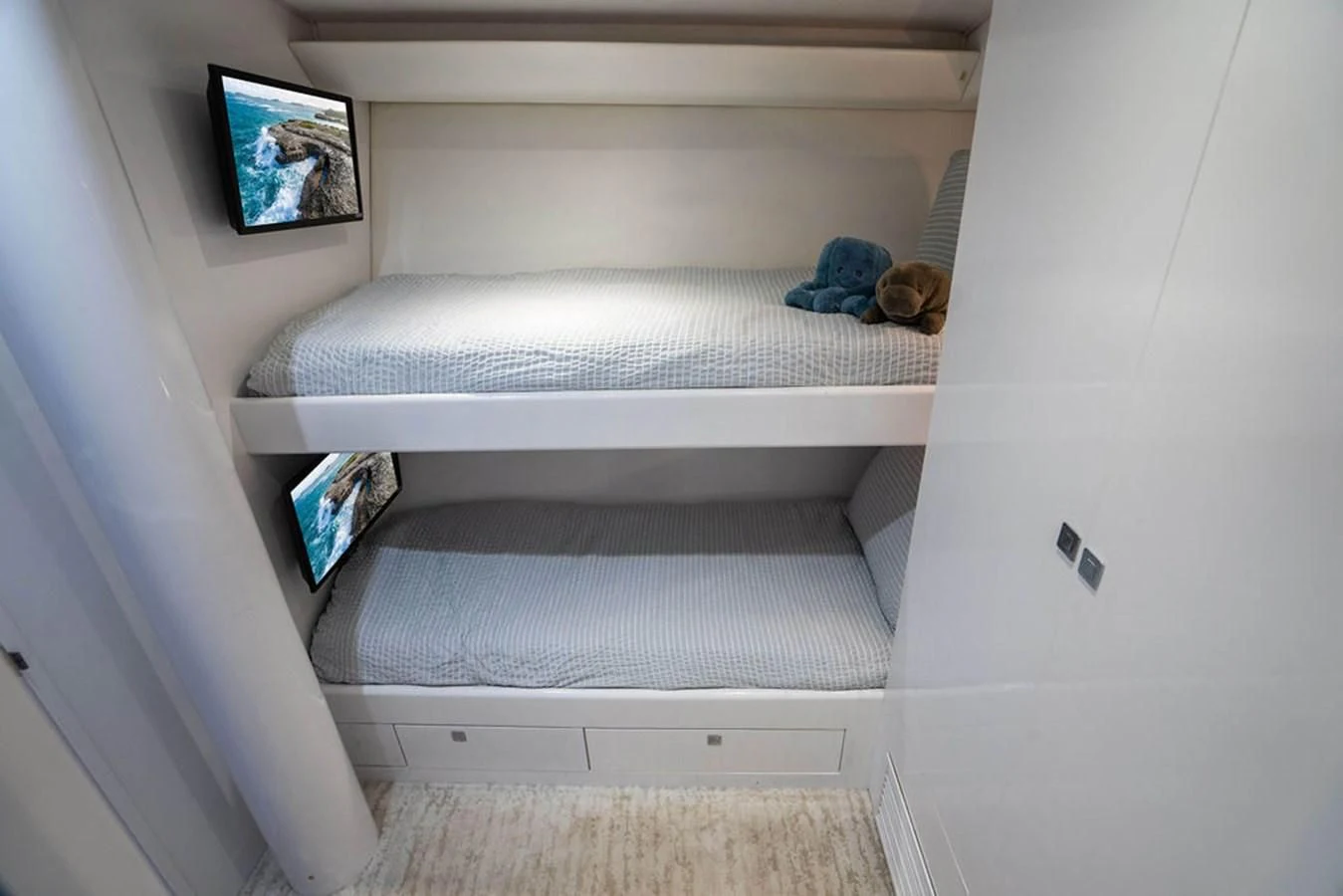 a cat lying on a bed aboard COURTNEY ANNE Yacht for Sale