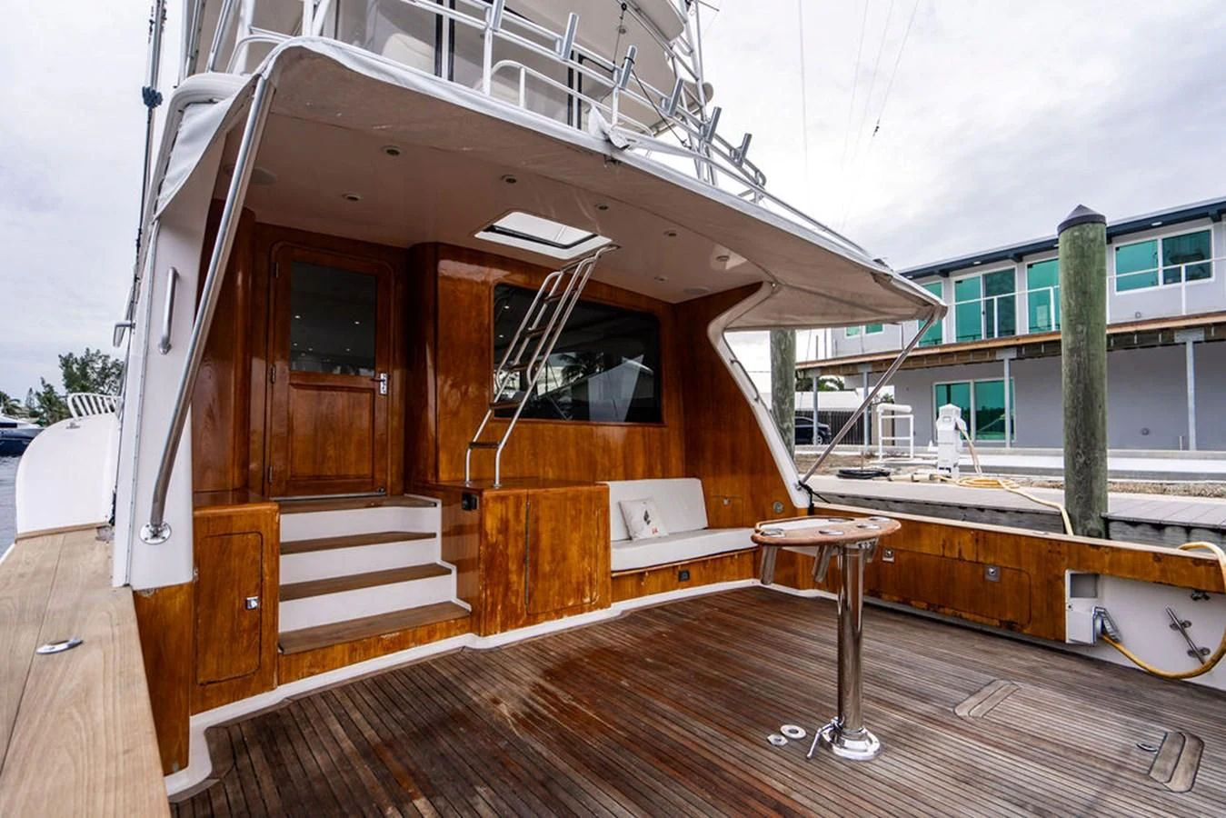 a wooden house with a deck aboard COURTNEY ANNE Yacht for Sale