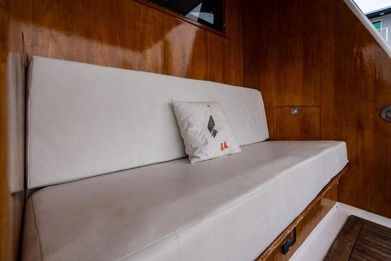 a bed with a white pillow aboard COURTNEY ANNE Yacht for Sale