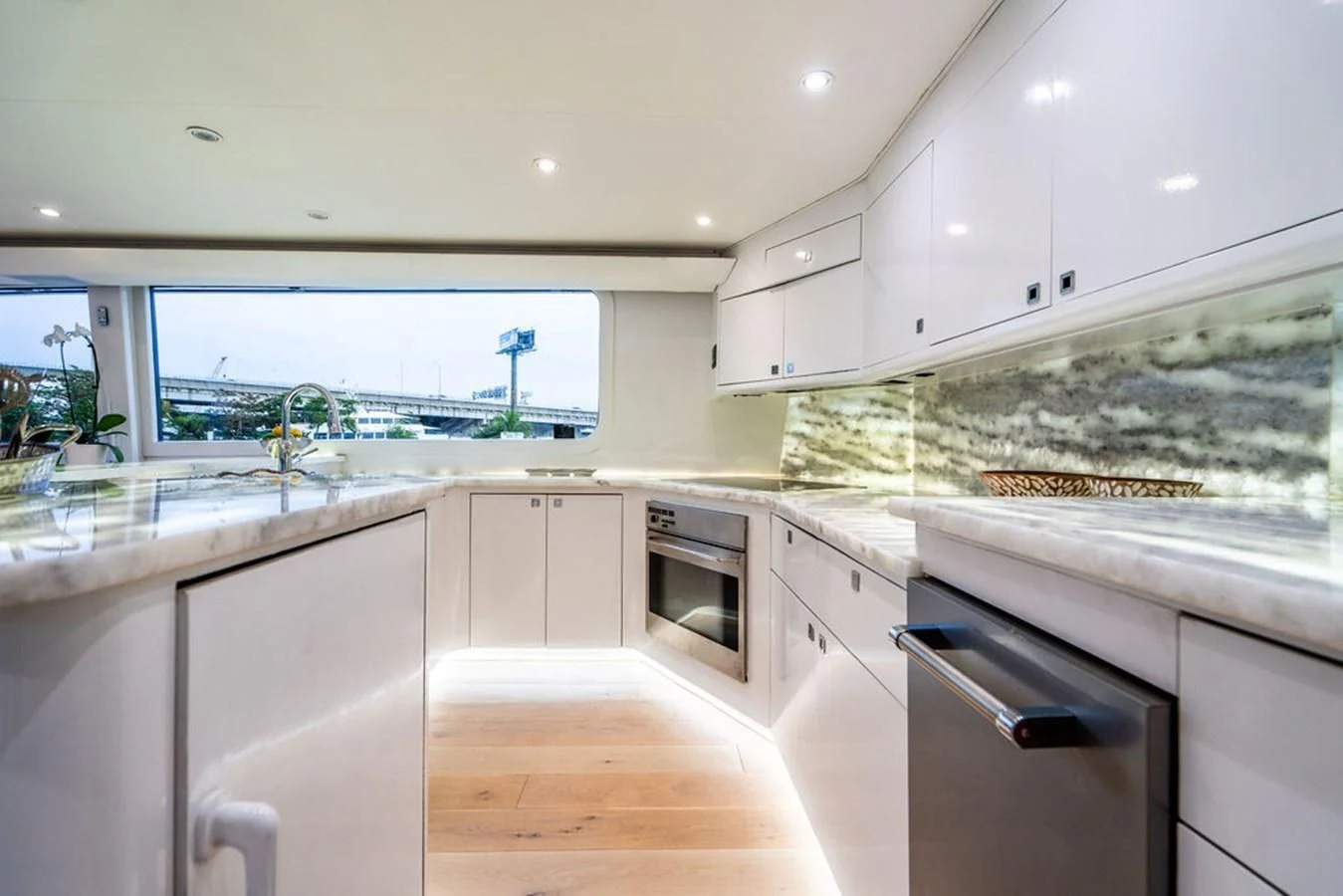 a kitchen with white cabinets aboard COURTNEY ANNE Yacht for Sale