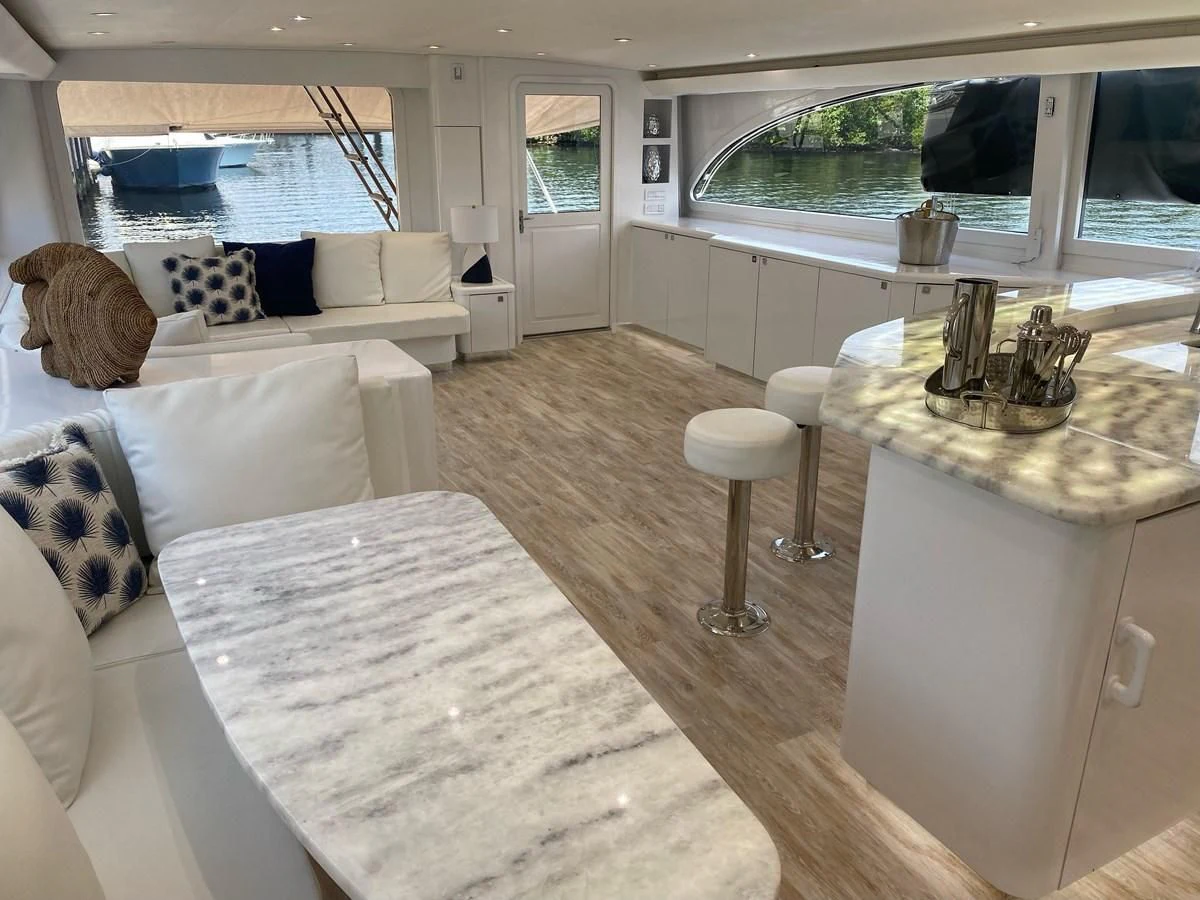 a living room with a large window aboard COURTNEY ANNE Yacht for Sale