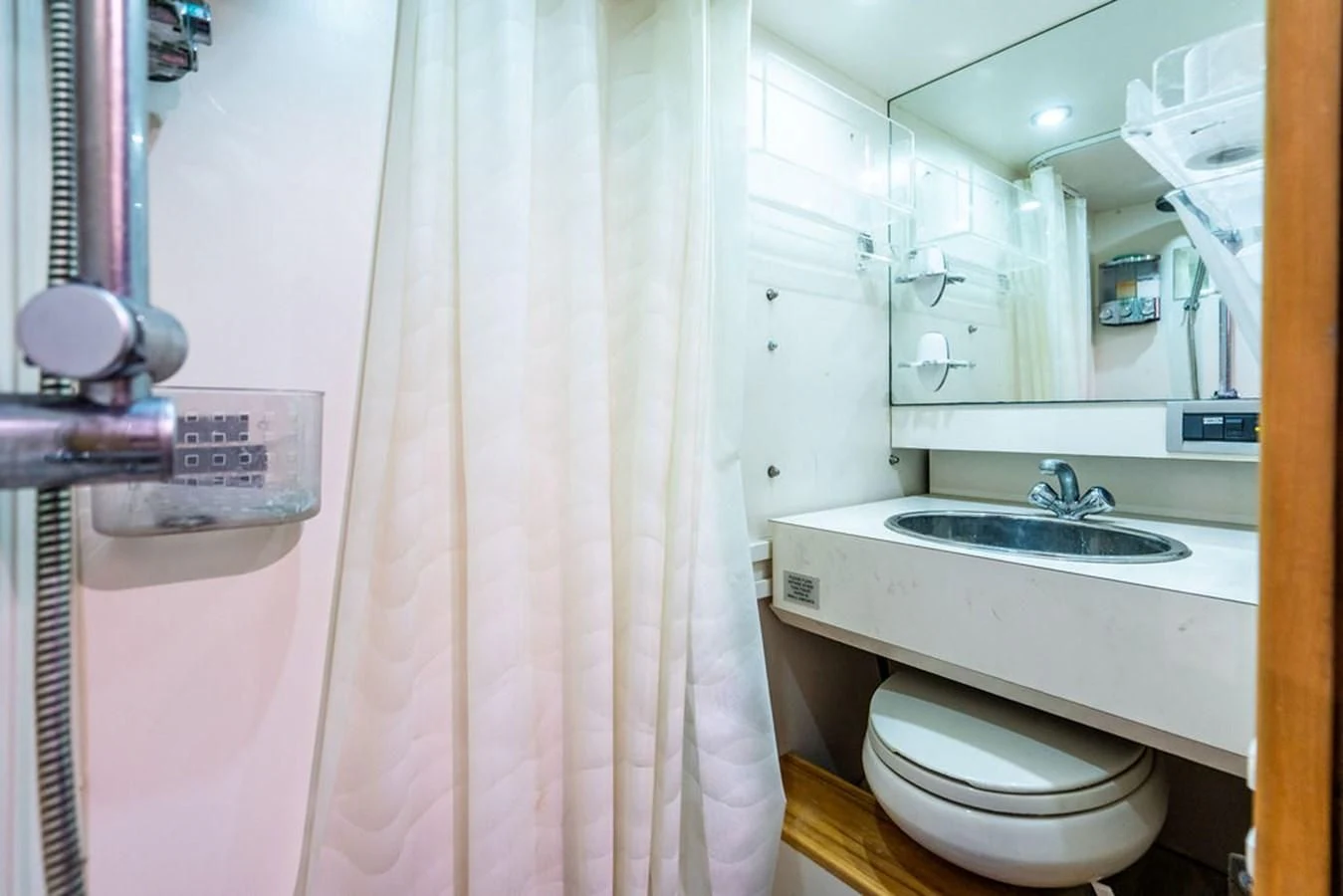 a bathroom with a toilet and sink aboard COURTNEY ANNE Yacht for Sale