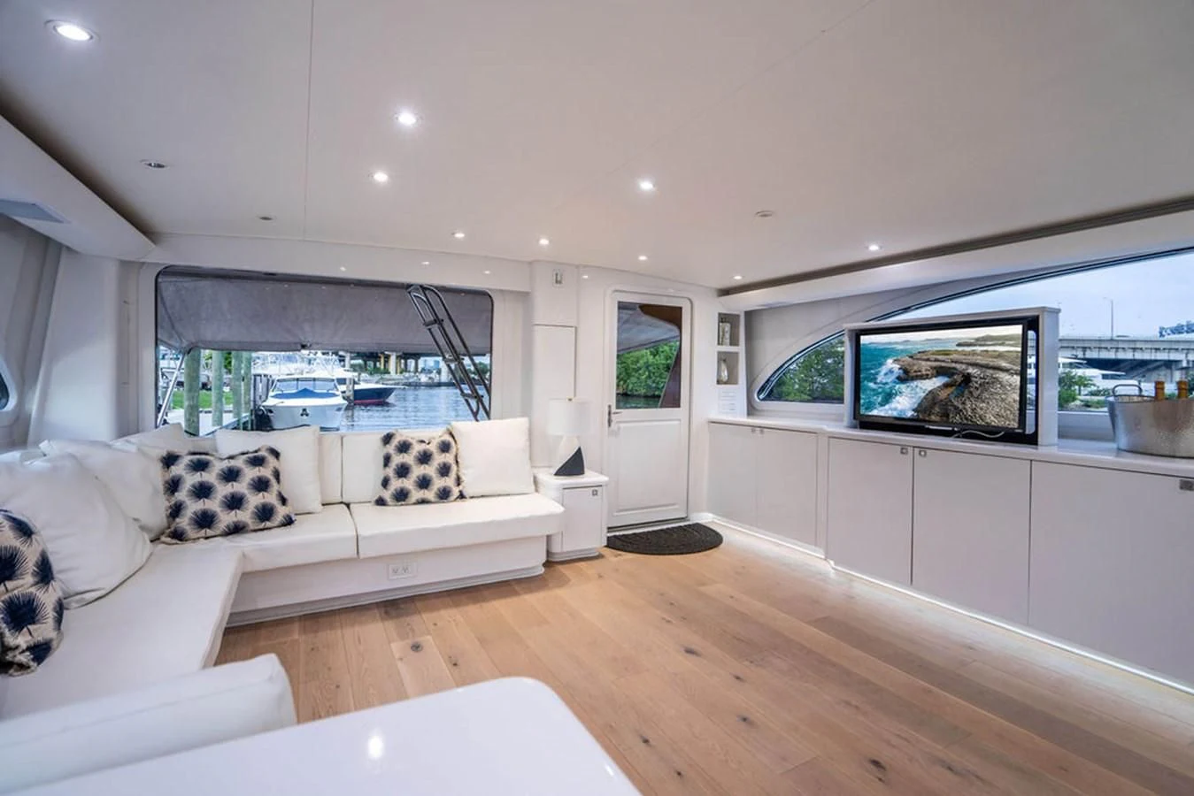 a living room with a large window aboard COURTNEY ANNE Yacht for Sale
