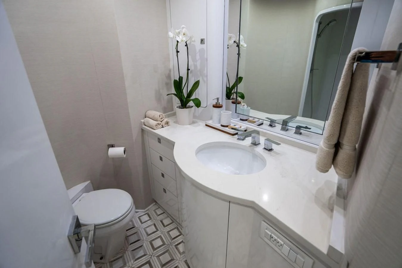 a bathroom with a sink and toilet aboard COURTNEY ANNE Yacht for Sale