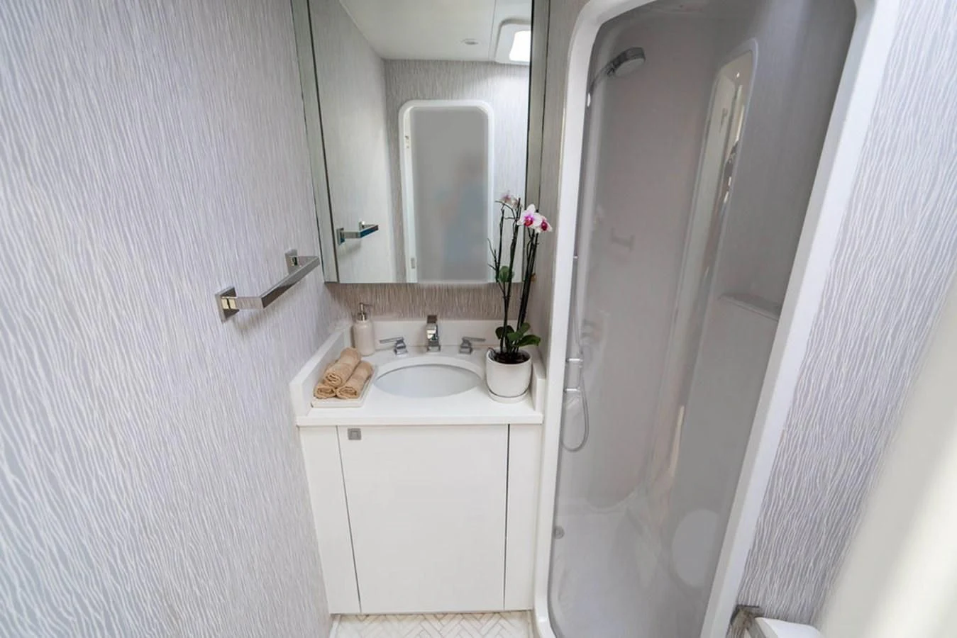 a bathroom with a sink and a mirror aboard COURTNEY ANNE Yacht for Sale