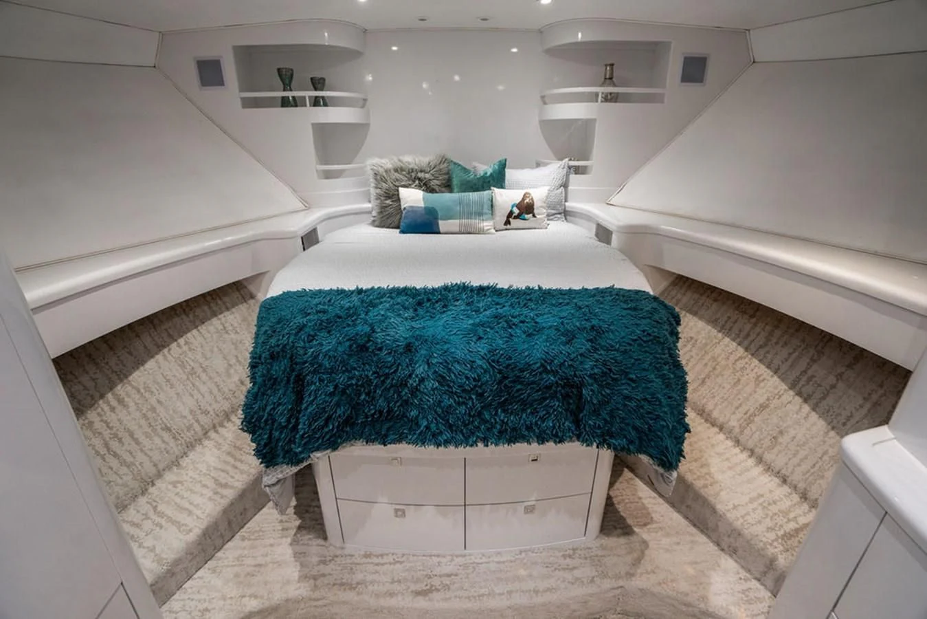 a white bathroom with a blue rug aboard COURTNEY ANNE Yacht for Sale