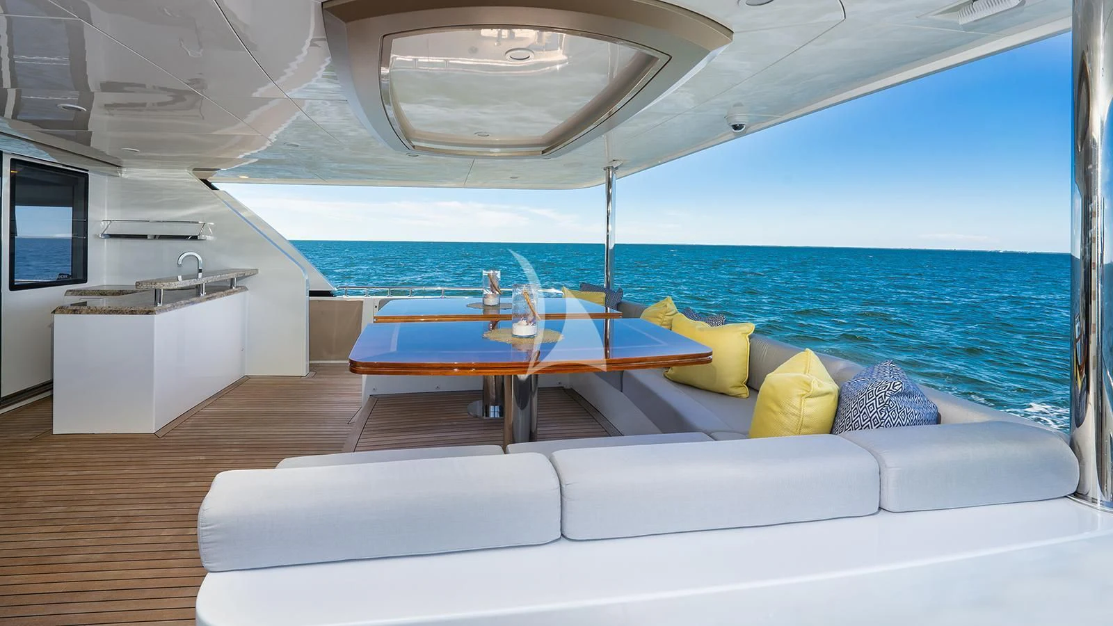 a boat with a table and chairs aboard SEA N SEA Yacht for Sale