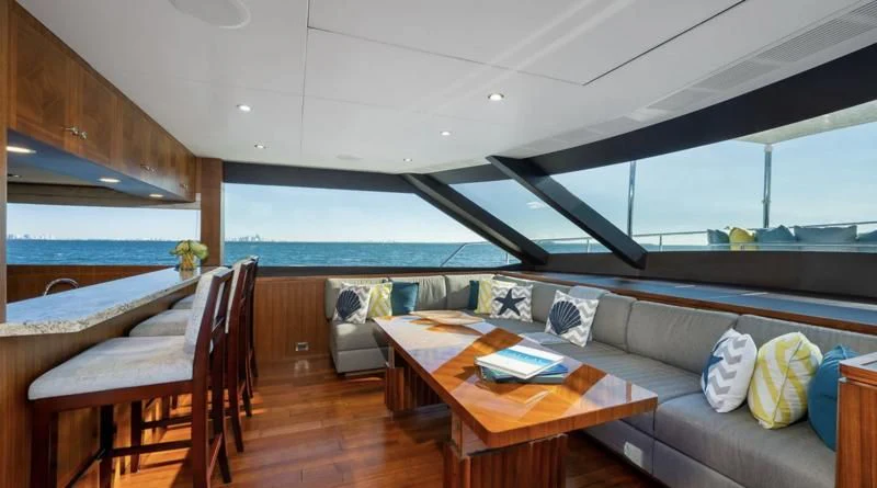 a living room with a couch and a table aboard SEA N SEA Yacht for Sale