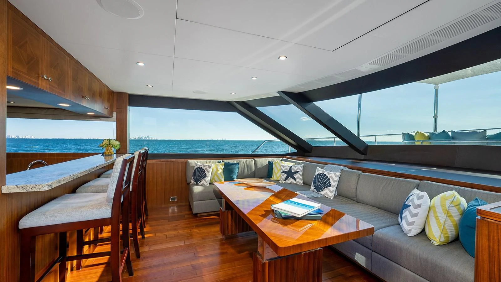 a living room with a couch and a table aboard SEA N SEA Yacht for Sale