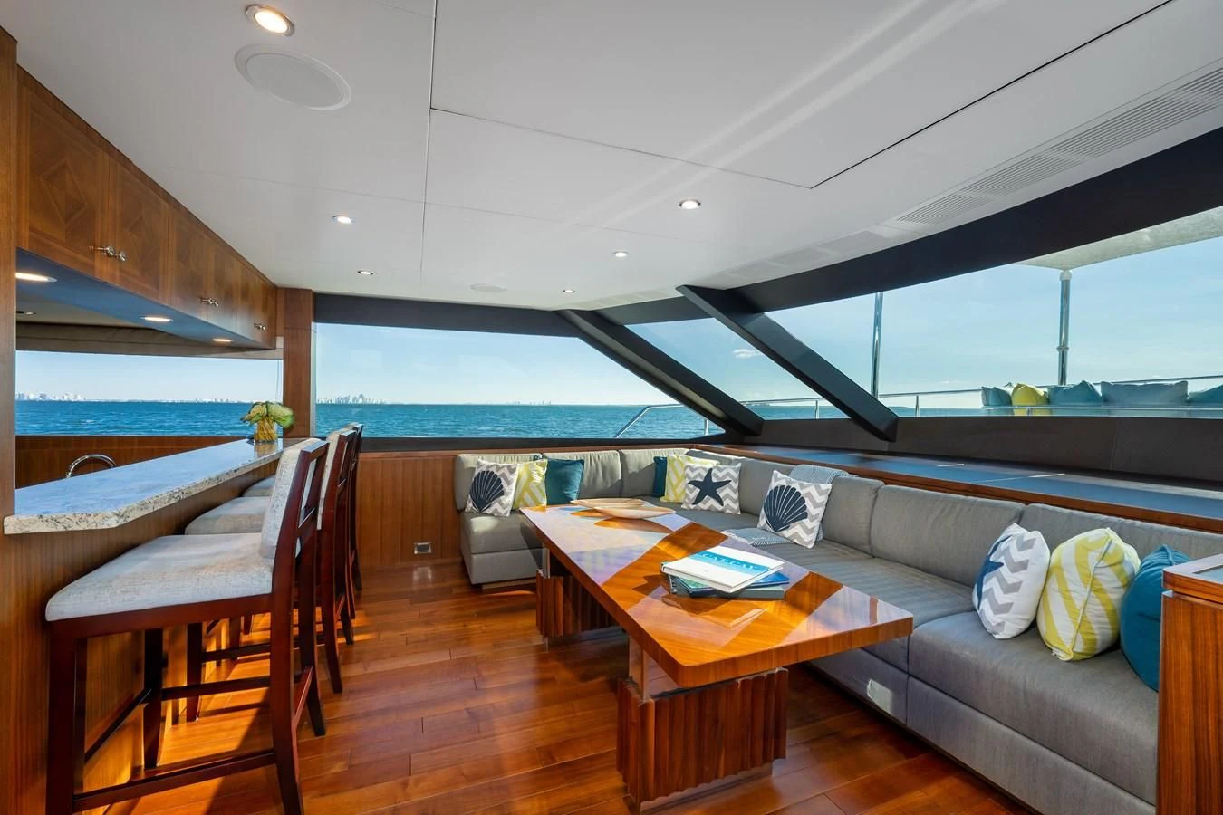 a living room with a couch and a table aboard SEA N SEA Yacht for Sale
