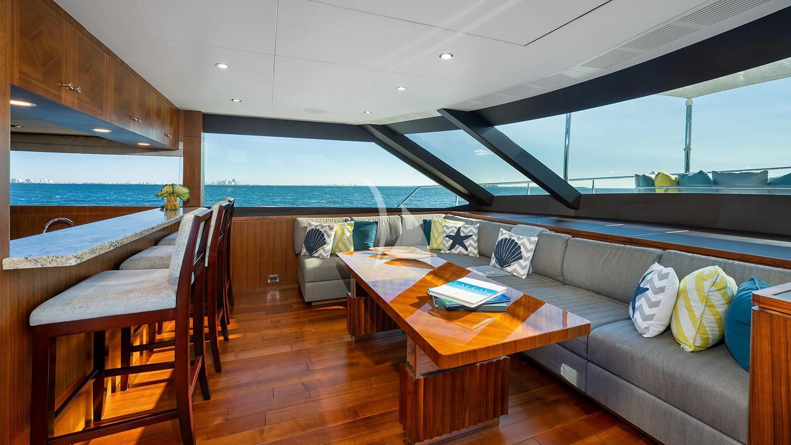 a living room with a couch and a table aboard SEA N SEA Yacht for Sale