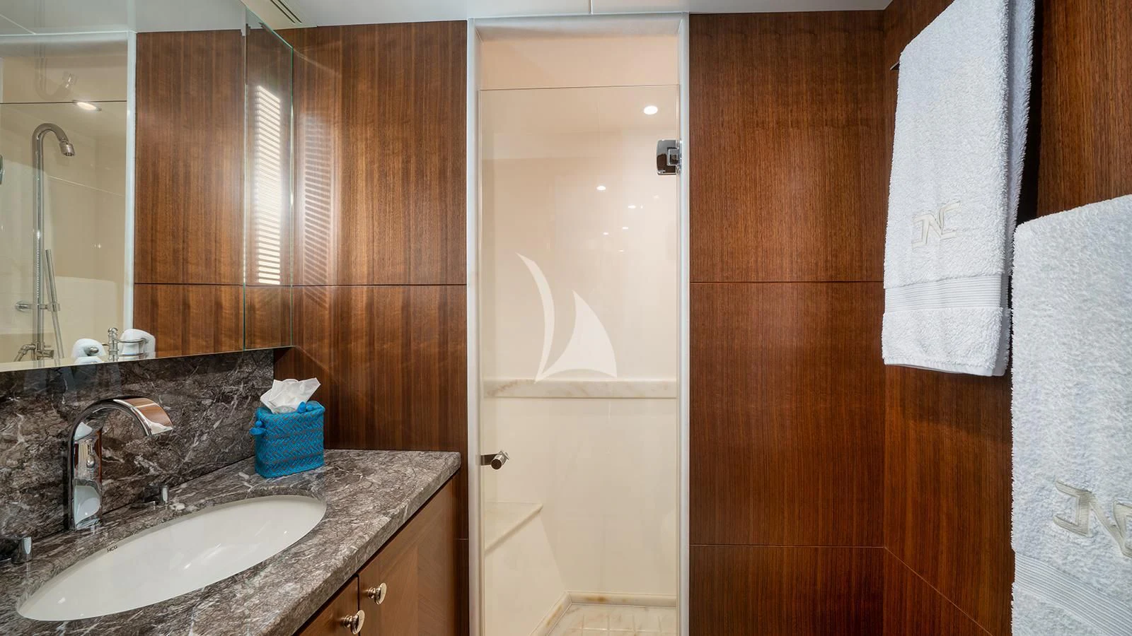 a bathroom with a sink and a shower aboard SEA N SEA Yacht for Sale