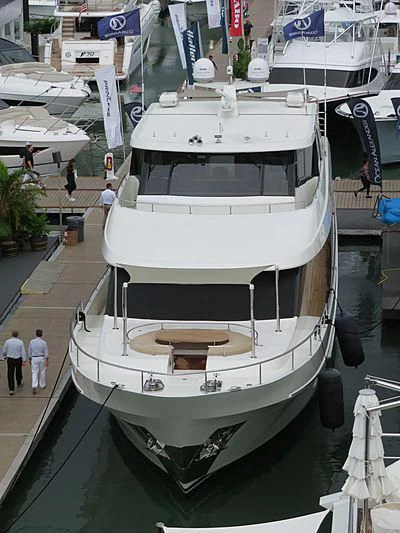 a large white boat in a harbor aboard SEA N SEA Yacht for Sale