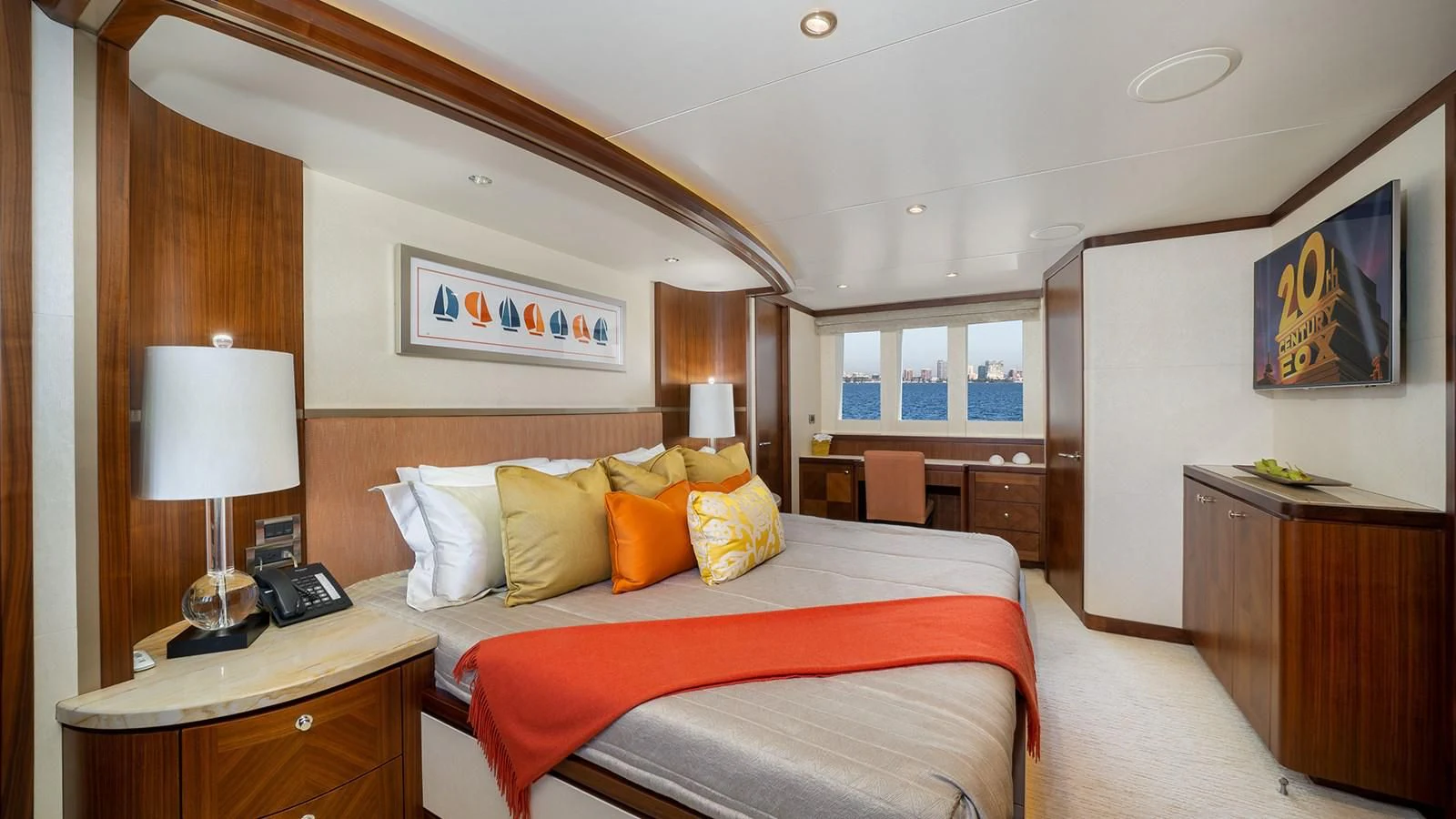 a hotel room with a bed and a desk aboard SEA N SEA Yacht for Sale