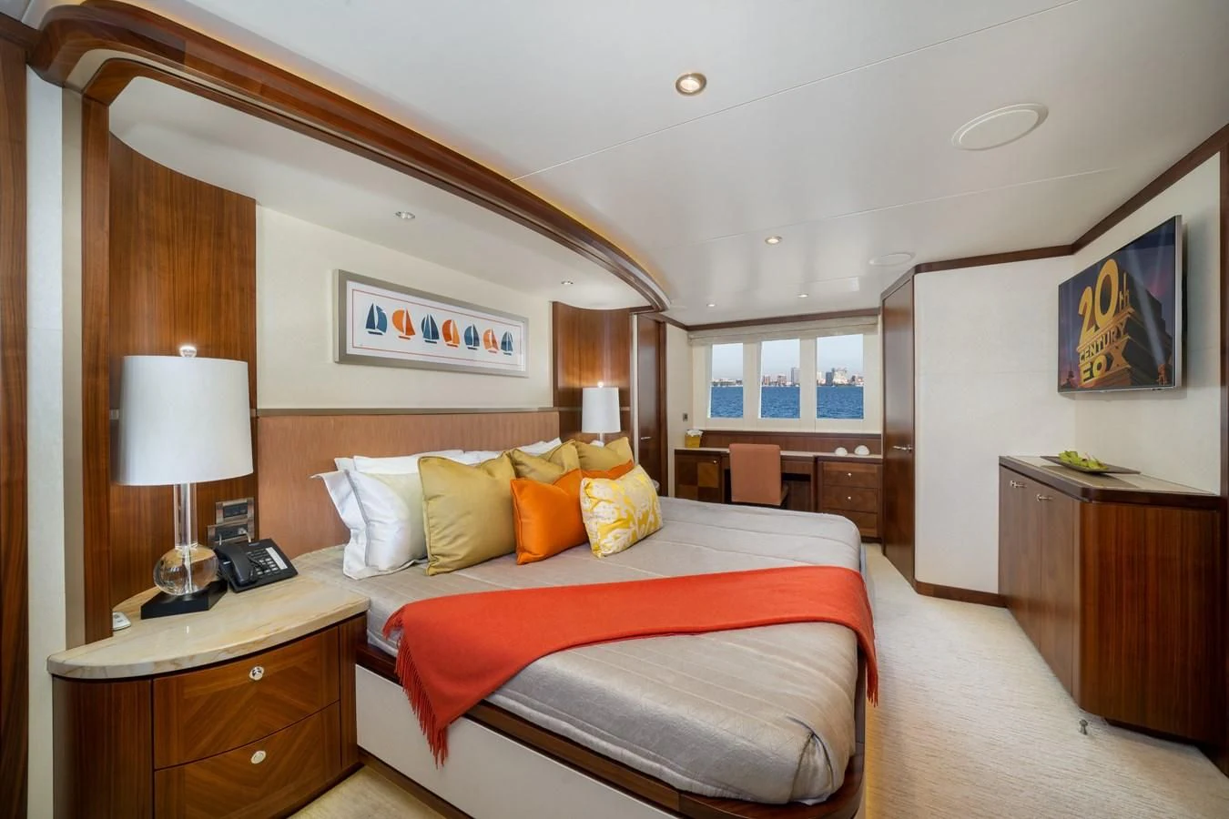 a bedroom with a bed and a desk aboard SEA N SEA Yacht for Sale