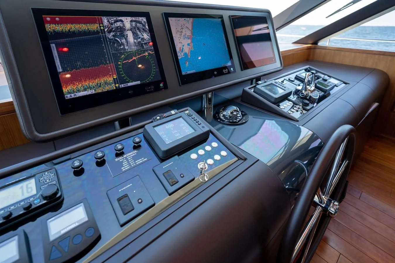 a control panel with multiple monitors aboard SEA N SEA Yacht for Sale