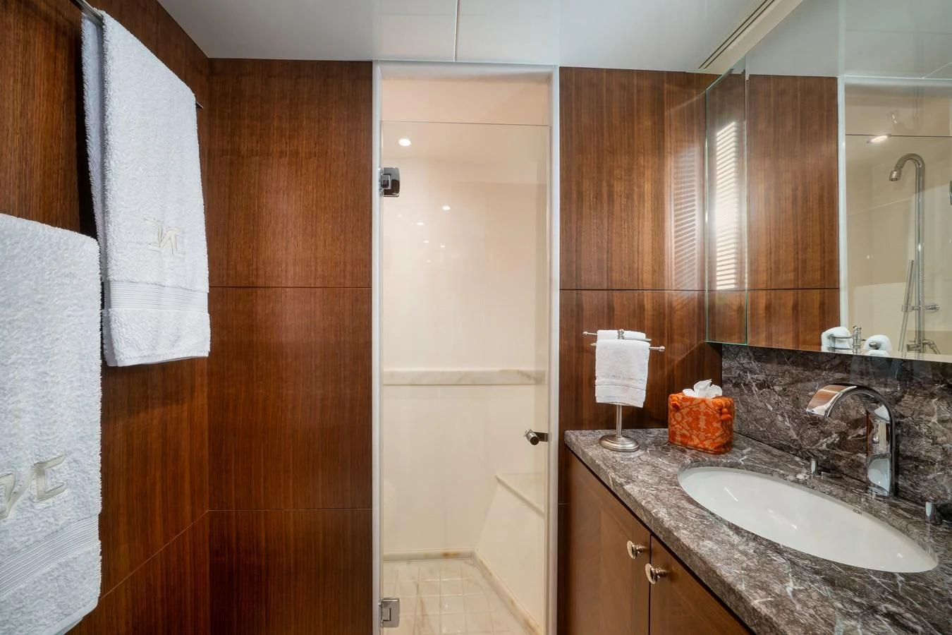 a bathroom with a sink and a mirror aboard SEA N SEA Yacht for Sale