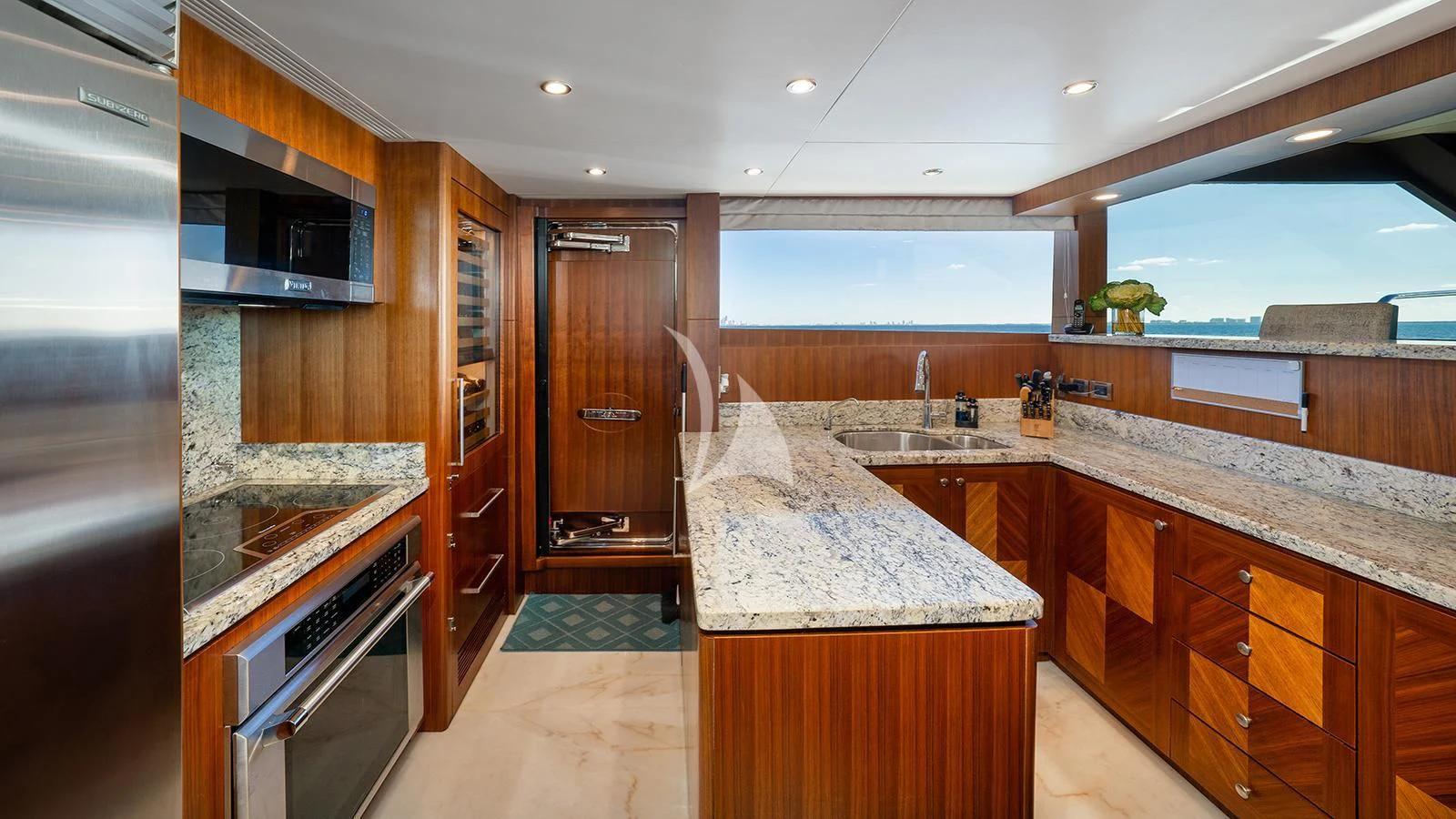 a kitchen with a large island aboard SEA N SEA Yacht for Sale