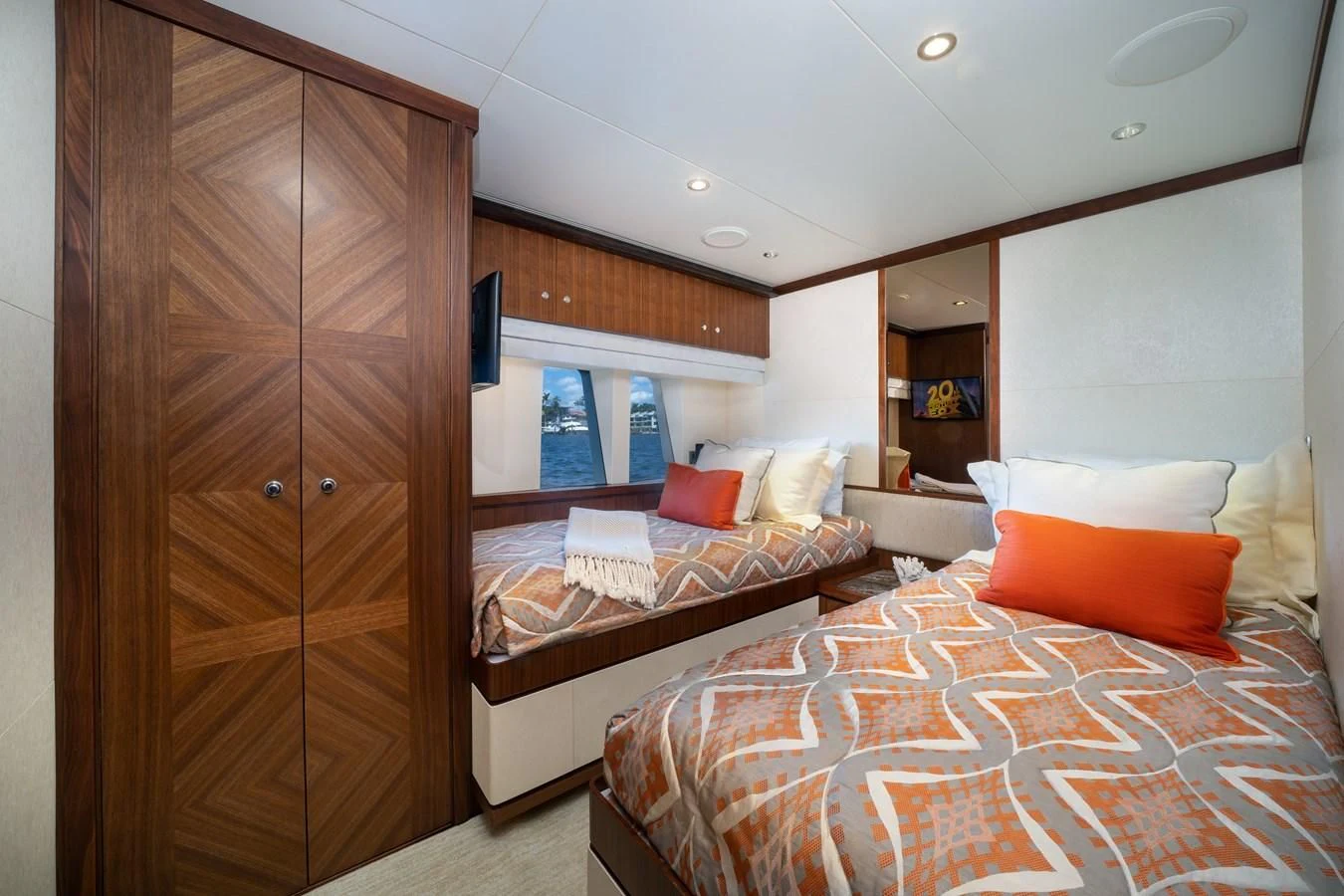 a room with a bed and a closet aboard SEA N SEA Yacht for Sale