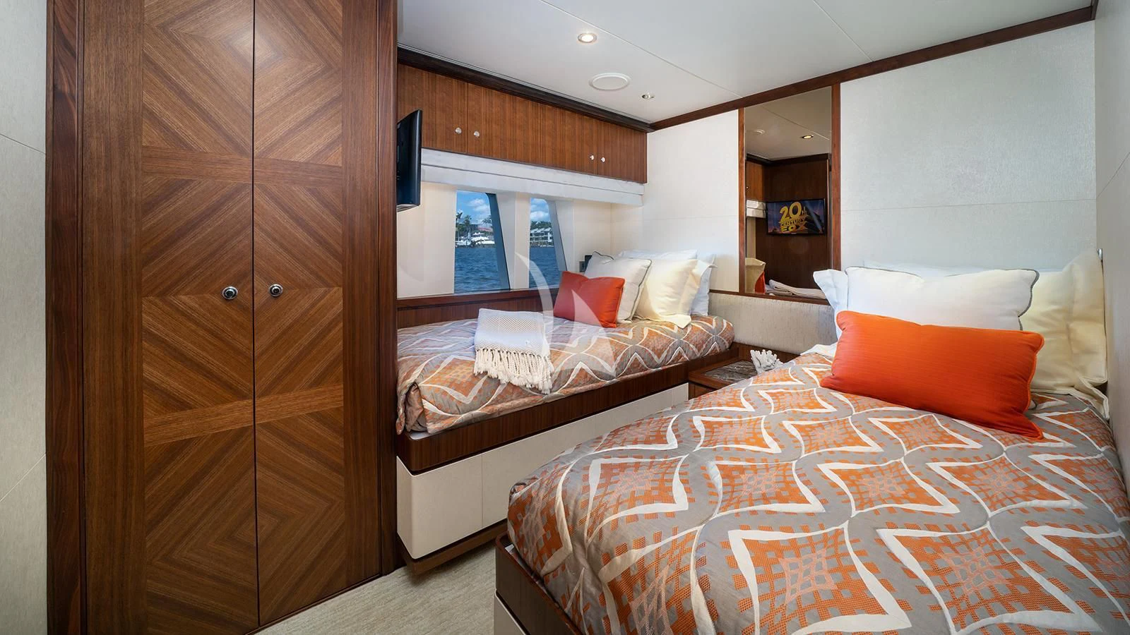 a room with a bed and a closet aboard SEA N SEA Yacht for Sale