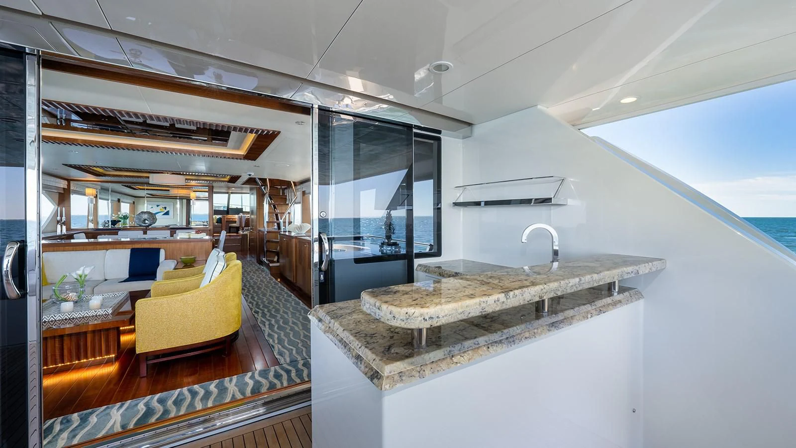 a modern kitchen with a large island aboard SEA N SEA Yacht for Sale