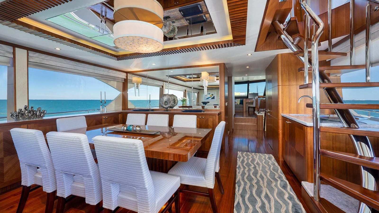 a room with chairs and tables aboard SEA N SEA Yacht for Sale