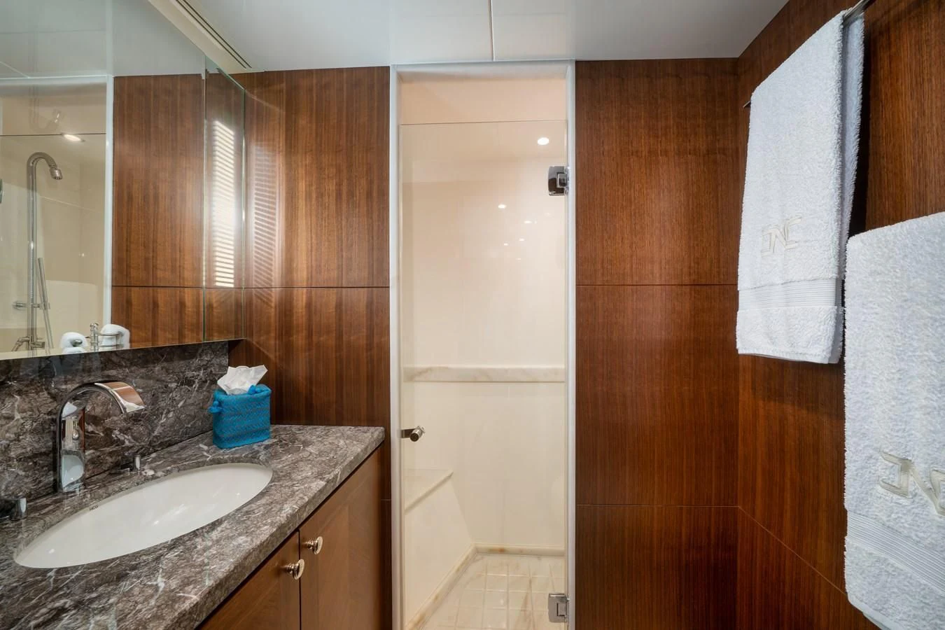 a bathroom with a sink and a mirror aboard SEA N SEA Yacht for Sale