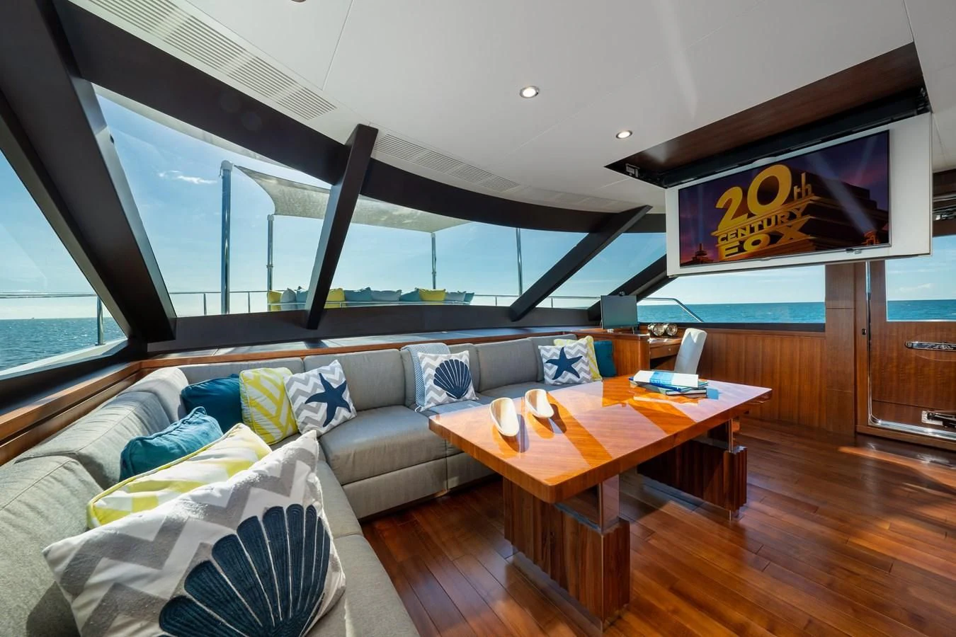 a living room with a couch and a table aboard SEA N SEA Yacht for Sale