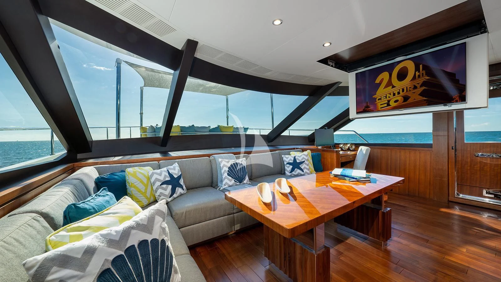 a living room with a couch and a table aboard SEA N SEA Yacht for Sale