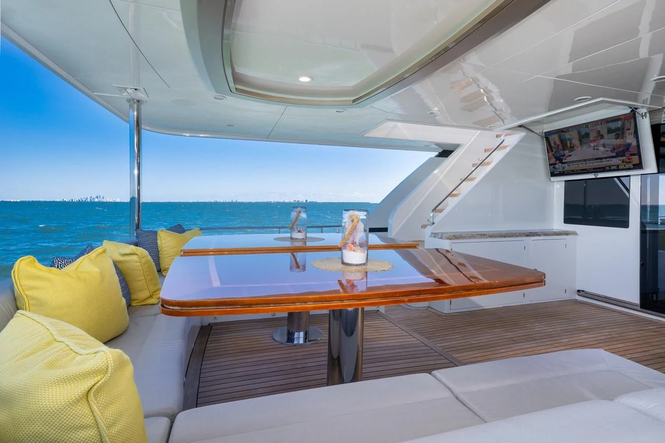 a boat with a table and chairs aboard SEA N SEA Yacht for Sale