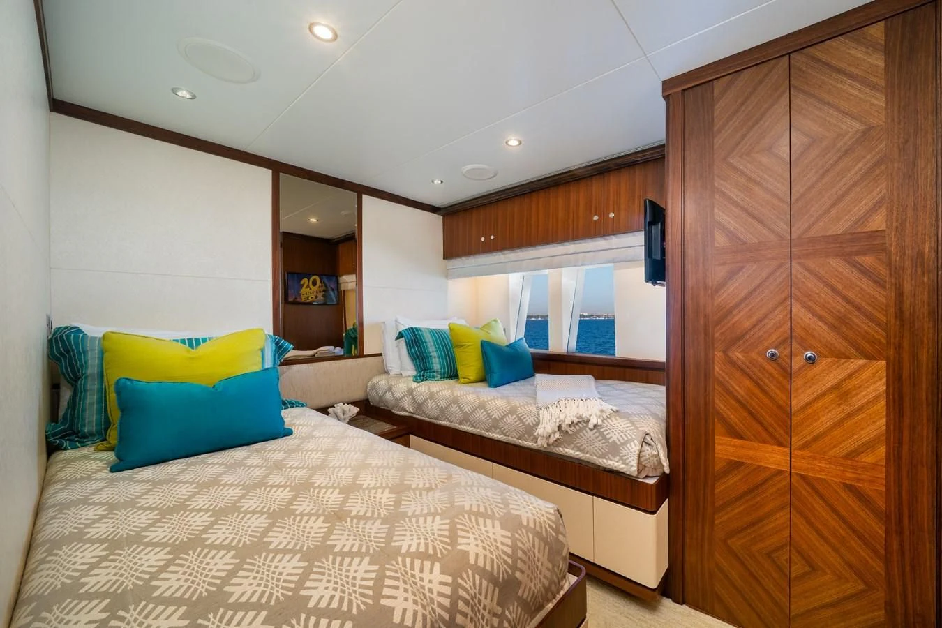 a bedroom with a bed and a closet aboard SEA N SEA Yacht for Sale