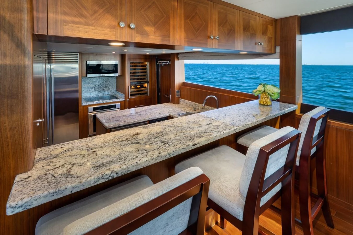 a kitchen with a large island aboard SEA N SEA Yacht for Sale