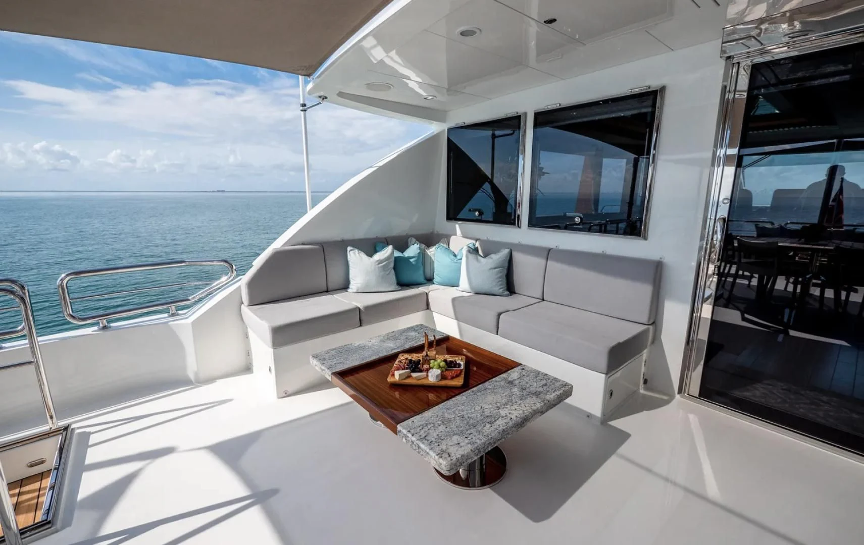 a room with a couch and a table and a television aboard SEA N SEA Yacht for Sale