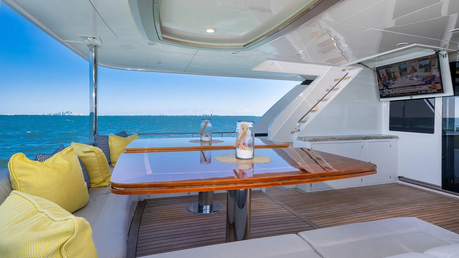 a boat with a table and chairs aboard SEA N SEA Yacht for Sale