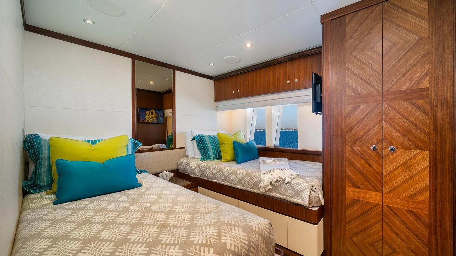 a room with a bed and a closet aboard SEA N SEA Yacht for Sale