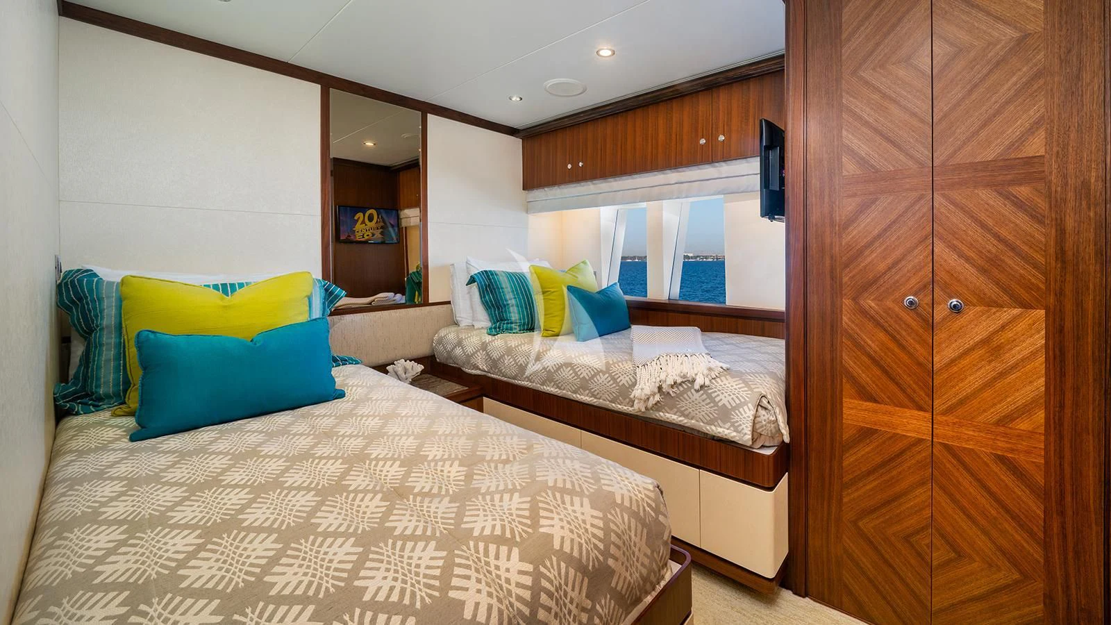 a bedroom with a bed and a closet aboard SEA N SEA Yacht for Sale