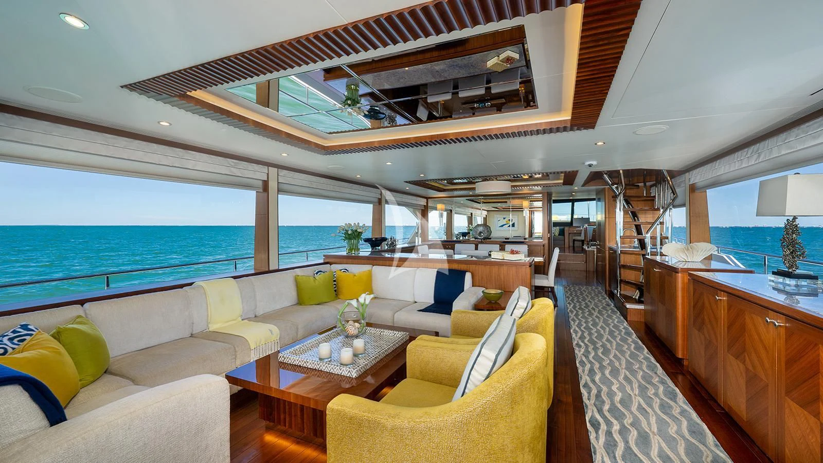 a living room with a large balcony aboard SEA N SEA Yacht for Sale