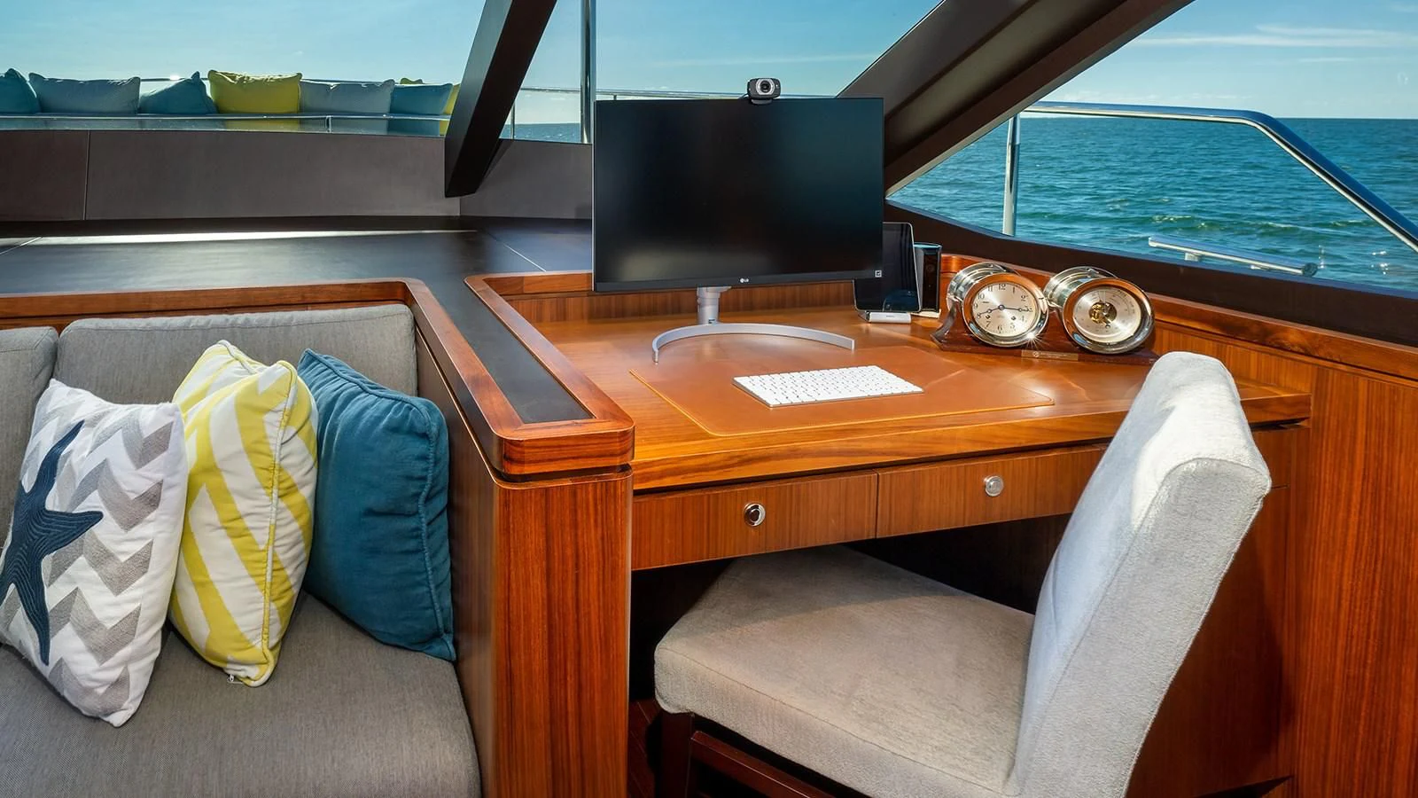 a desk with a chair and a tv on it aboard SEA N SEA Yacht for Sale